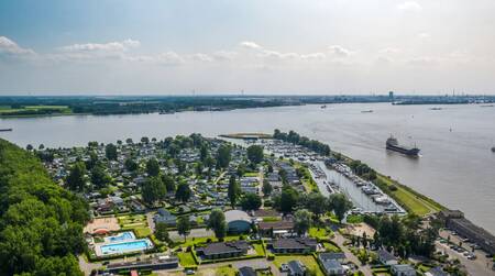 Aerial view of the EuroParcs De Biesbosch holiday park and the Hollands Diep