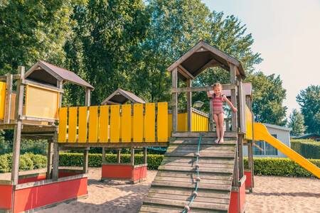 Girl plays in the playground at the EuroParcs De Biesbosch holiday park