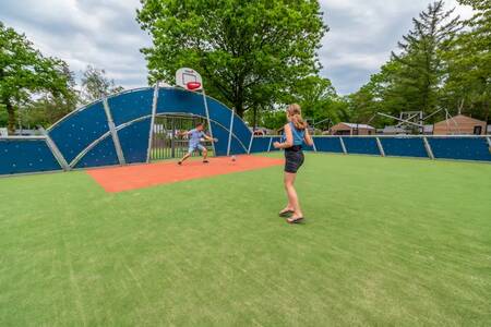 Children playing on the multifunctional playing field at the EuroParcs De Hooge Veluwe holiday park