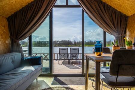 View from a Tiny House on the Reevemeer at holiday park EuroParcs De IJssel Eilanden