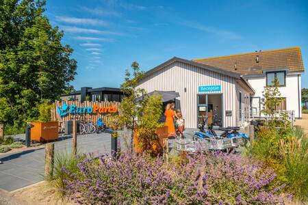 The main building of EuroParcs De Koog with reception, bicycle rental and entertainment room