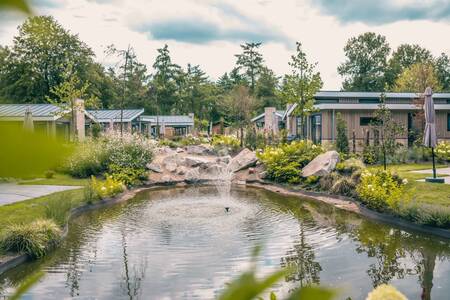 Holiday homes by a pond at holiday park EuroParcs De Utrechtse Heuvelrug