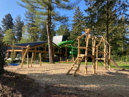 The wooden playground next to the swimming pool of holiday park EuroParcs De Utrechtse Heuvelrug