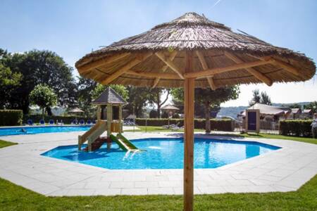 The paddling pool with small slide at holiday park EuroParcs Gulperberg