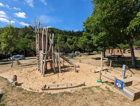 Playground with wooden play equipment at holiday park EuroParcs Kohnenhof