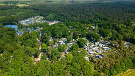 Aerial view of holiday homes on holiday park EuroParcs Maasduinen and forest