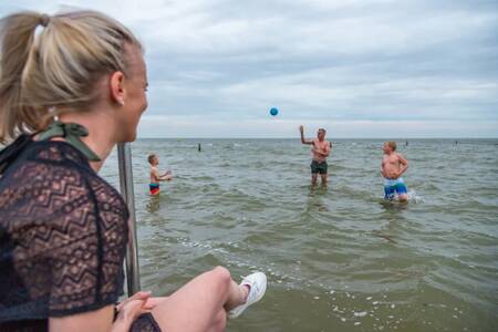 People play in the water of the Markermeer at the EuroParcs Markermeer holiday park
