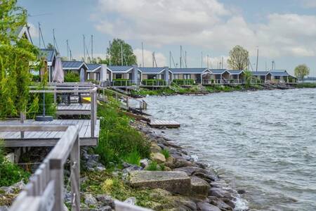 Chalets with verandas on the water at holiday park EuroParcs Markermeer