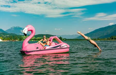 Family on a pedal boat on the Pressegger See near EuroParcs Pressegger See