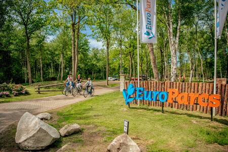 Family bicycle at the entrance of holiday park EuroParcs Ruinen
