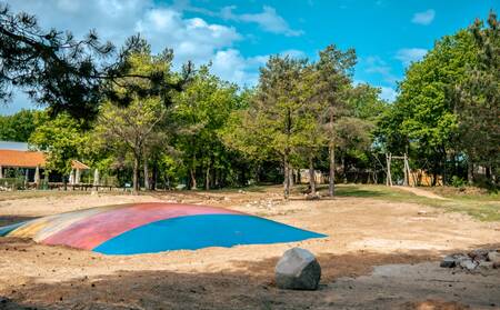 Air Trampoline and playground equipment in the playground of holiday park EuroParcs Ruinen