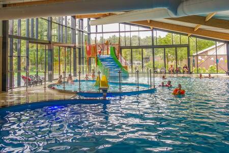 People swimming in the indoor pool of holiday park EuroParcs Ruinen