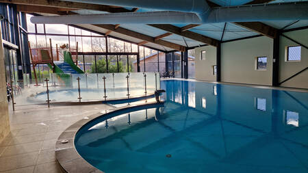 The swimming pool with toddler pool and wide slide at the EuroParcs Ruinen holiday park