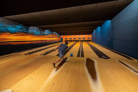 Man bowling on the bowling alley of the EuroParcs Schoneveld holiday park