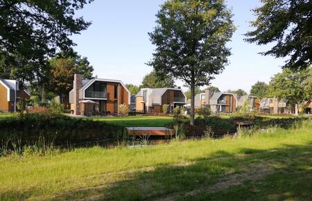 Detached holiday homes on a ditch at the EuroParcs Zuiderzee holiday park