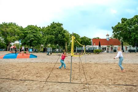 People playing volleyball and children on an air trampoline at Europarcs Bad Hoophuizen