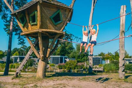 Children play in the playground at holiday park Europarcs EuroParcs Zilverstrand