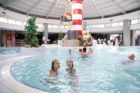 People swim in the indoor pool of holiday park Europarcs EuroParcs Zilverstrand