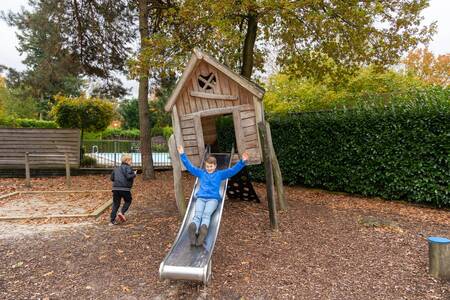 Children play in a playground at Bungalow Park Het Verscholen Dorp