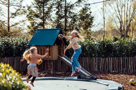 Children playing in a playground at the Het Wylde Pad holiday park