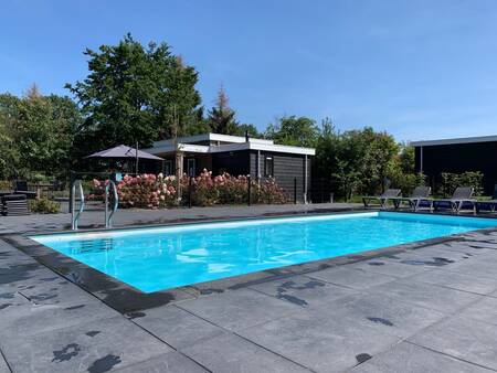 The heated outdoor swimming pool of the Buitenplaats Holten holiday park