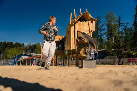 Children play in a playground at holiday park Wilsumer Berge