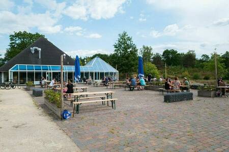 People on the terrace of the restaurant at Holiday Park Wilsumer Berge