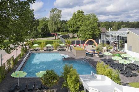 The outdoor pool with wide slide at holiday park 't Rheezerwold