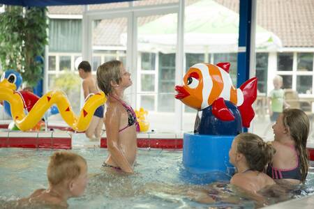 Children swimming in the paddling pool of holiday park Mölke