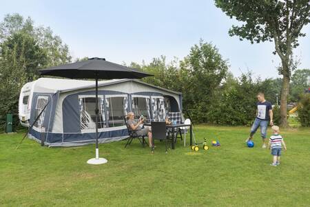 A camping pitch at the holiday park Kampeerdorp de Zandstuve