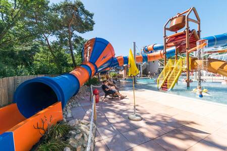 Outdoor pool with slides at camping village de Zandstuve