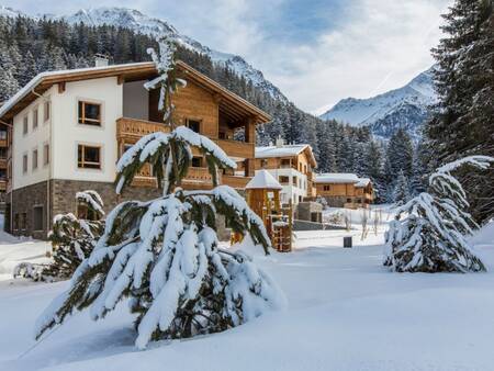 Apartment buildings in the snow at Landal Alpine Lodge Lenzerheide