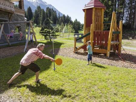 Children play in the playground at Landal Alpine Lodge Lenzerheide