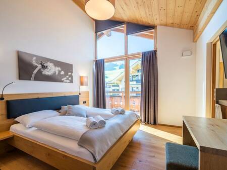 Spacious bedroom in an apartment at Landal Alpen Resort Maria Alm