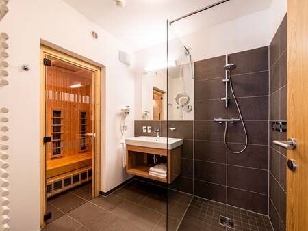 Bathroom with a sauna in an apartment at Landal Alpen Resort Maria Alm