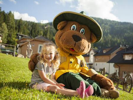 Girl with Bollo the bear at holiday park Landal Bad Kleinkirchheim