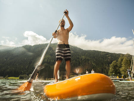 Man on a supboard at the Landal Bad Kleinkirchheim holiday park