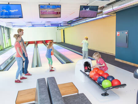 Bowling at the bowling alley of holiday park Landal Beach Resort Ooghduyne
