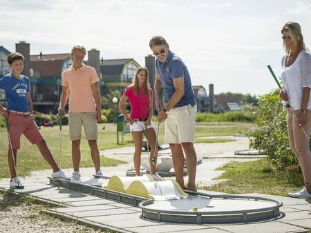 Play a game of mini golf on the mini golf course of holiday park Landal Beach Resort Ooghduyne