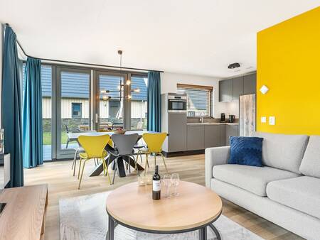 Living room and kitchen of a holiday home at Landal Berger Duinen holiday park