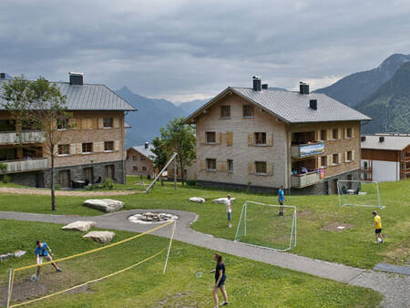 Badminton field and football field in front of an apartment complex at Landal Brandnertal