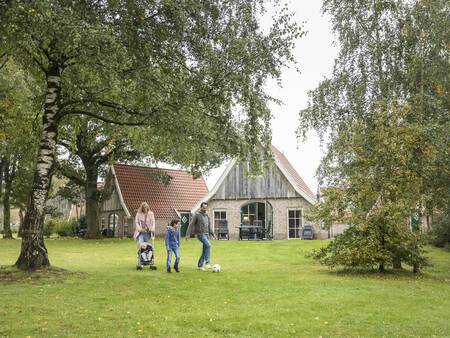 Family walks between the holiday homes at Landal De Hellendoornse Berg holiday park