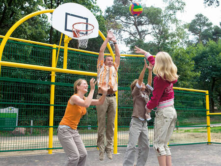 Family plays a game of basketball at Landal De Vers holiday park