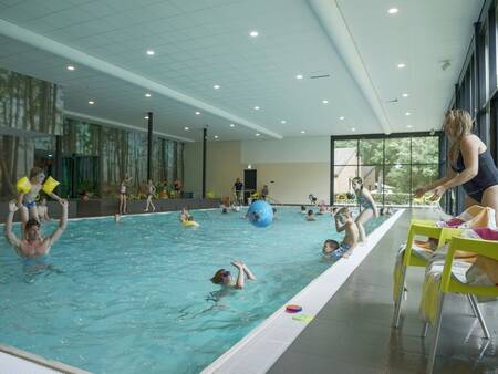 People swim in the indoor pool of holiday park Landal De Vers