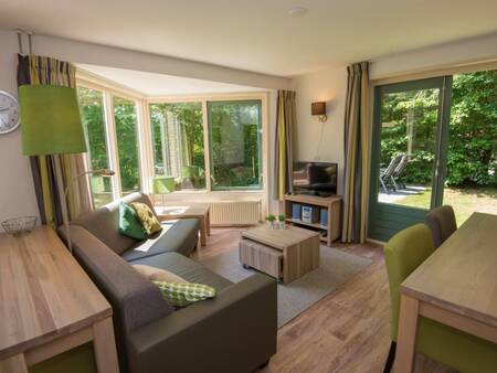 Living room of a holiday home at Landal De Vlegge . holiday park