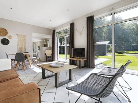 Cozy living room of a holiday home at Landal De Vlinderhoeve holiday park