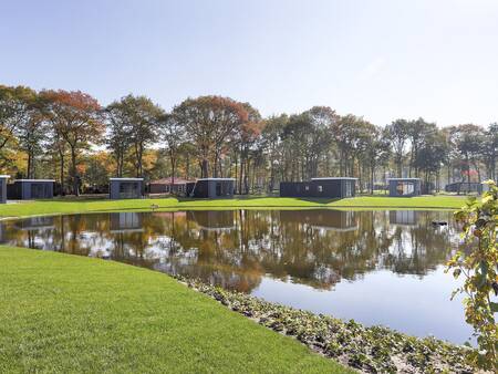 Holiday homes by a pond at the Landal De Vlinderhoeve holiday park