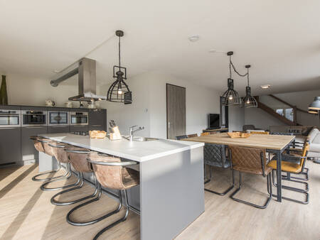 Large kitchen with table from a holiday home at the Landal Domein de Schatberg holiday park