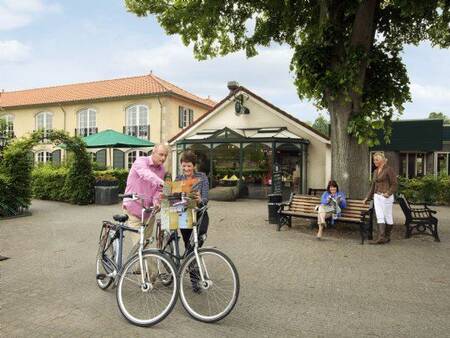 Couple plans a cycling route at the Landal Duc de Brabant holiday park
