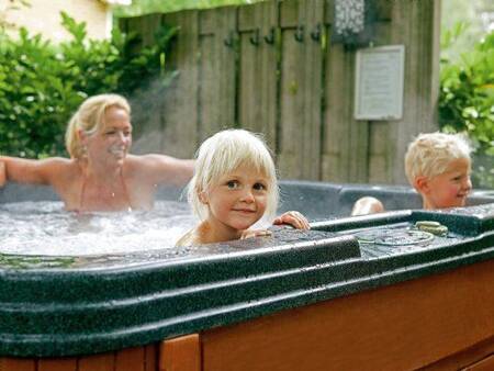 Family in a jacuzzi at Landal Duc de Brabant holiday park